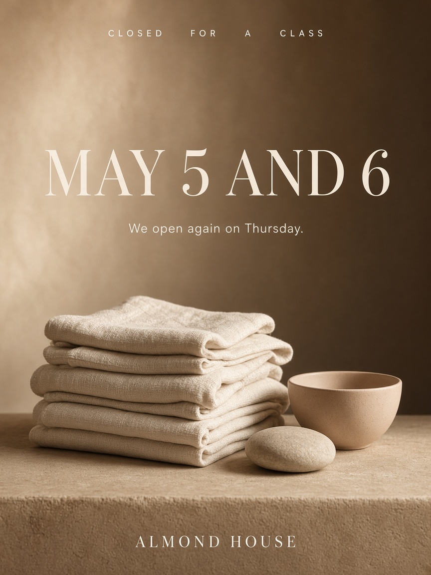 Almond House post: "MAY 5 AND 6", folded ivory linen towels on a nude plaster ledge under one warm raking light.