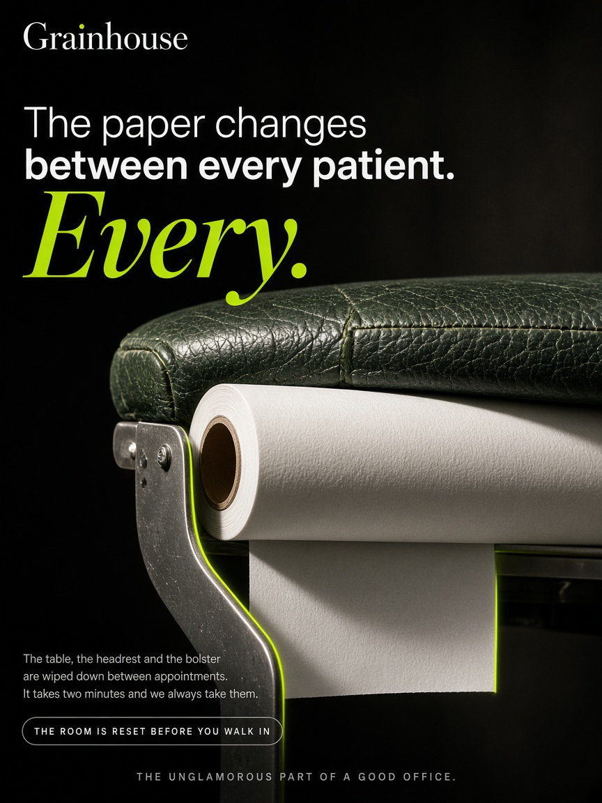 Grainhouse Chiropractic post: "The paper changes between every patient.", a black macro photograph of a roll of examination paper on the end of a treatment table.