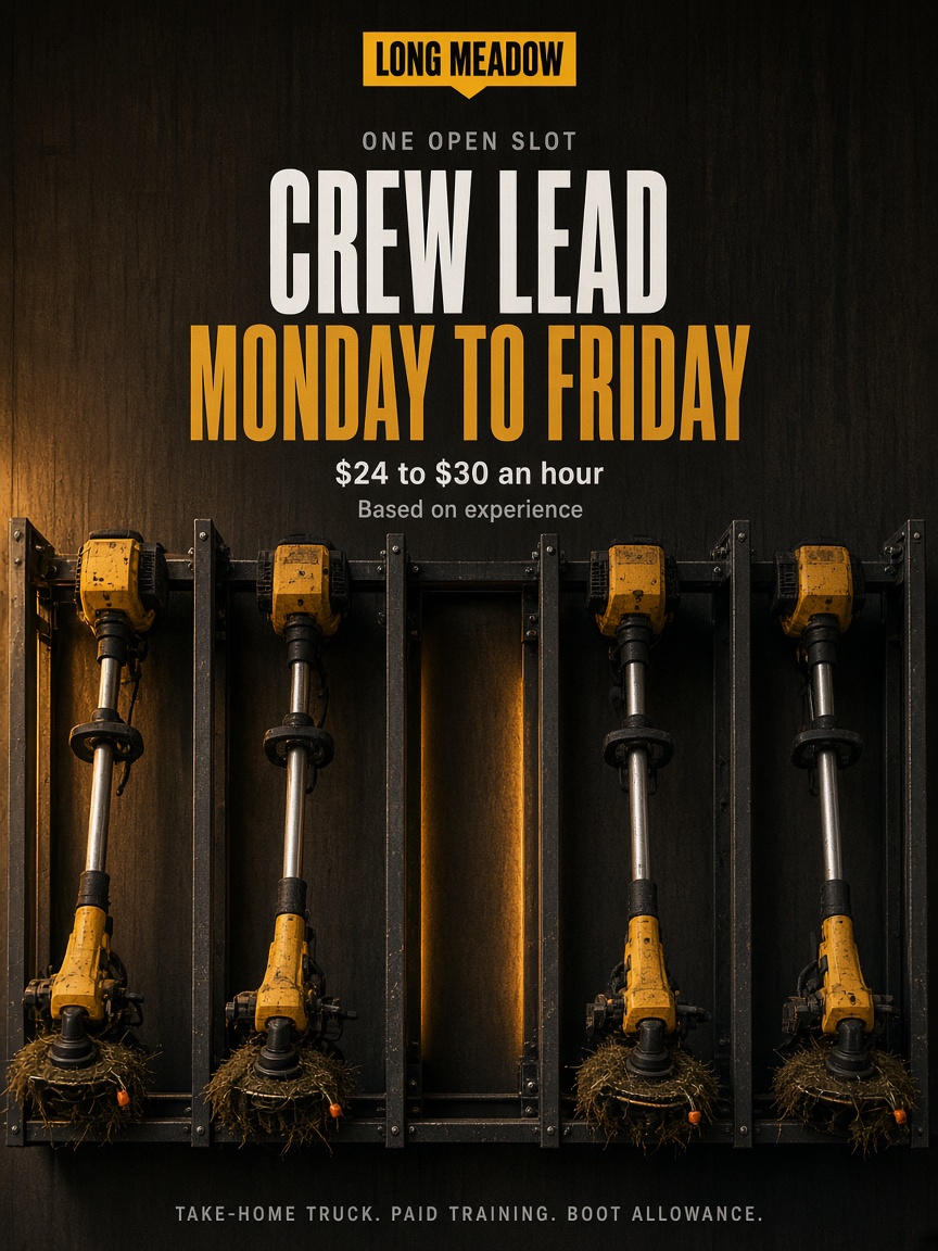 Long Meadow post: "CREW LEAD", a five-slot rack of string trimmers with the middle slot empty in warm raking light.